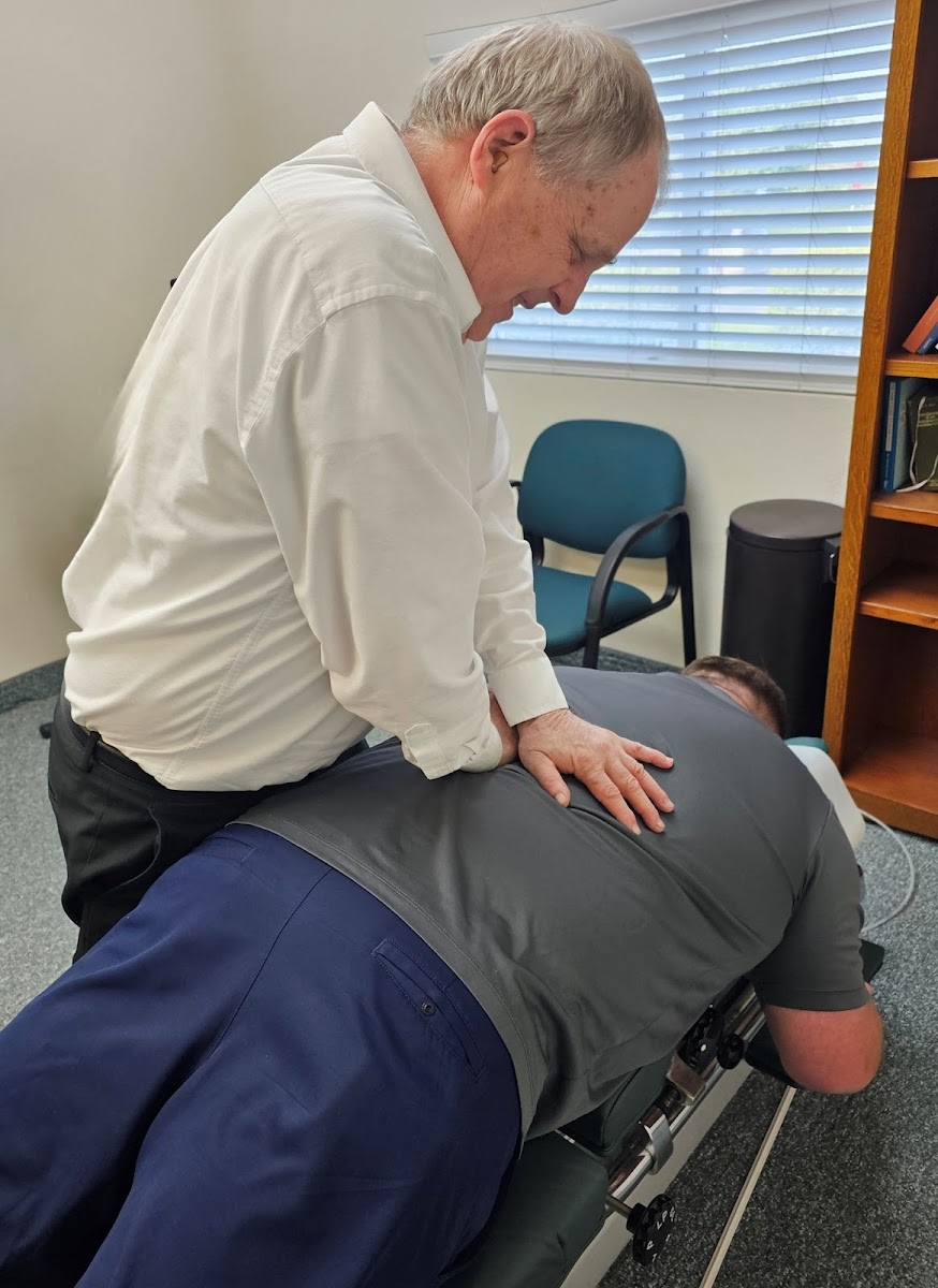 Chiropractor performing adjustment on patient